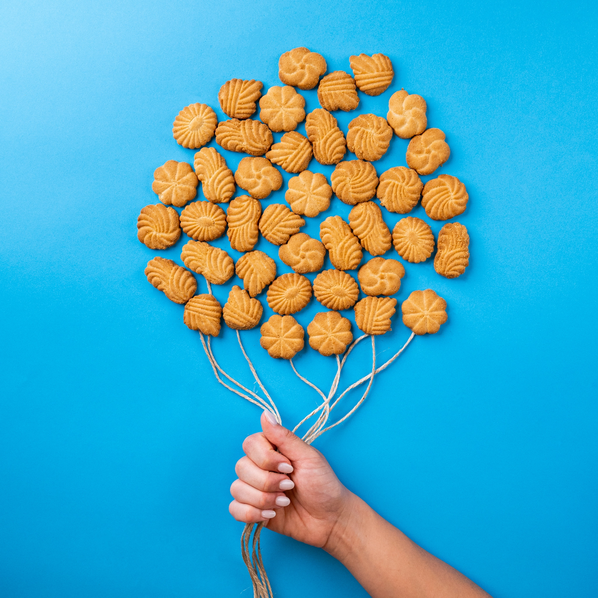 shooting campagna pubblicitaria creativa biscotti Frolsi posizionati per formare un palloncino